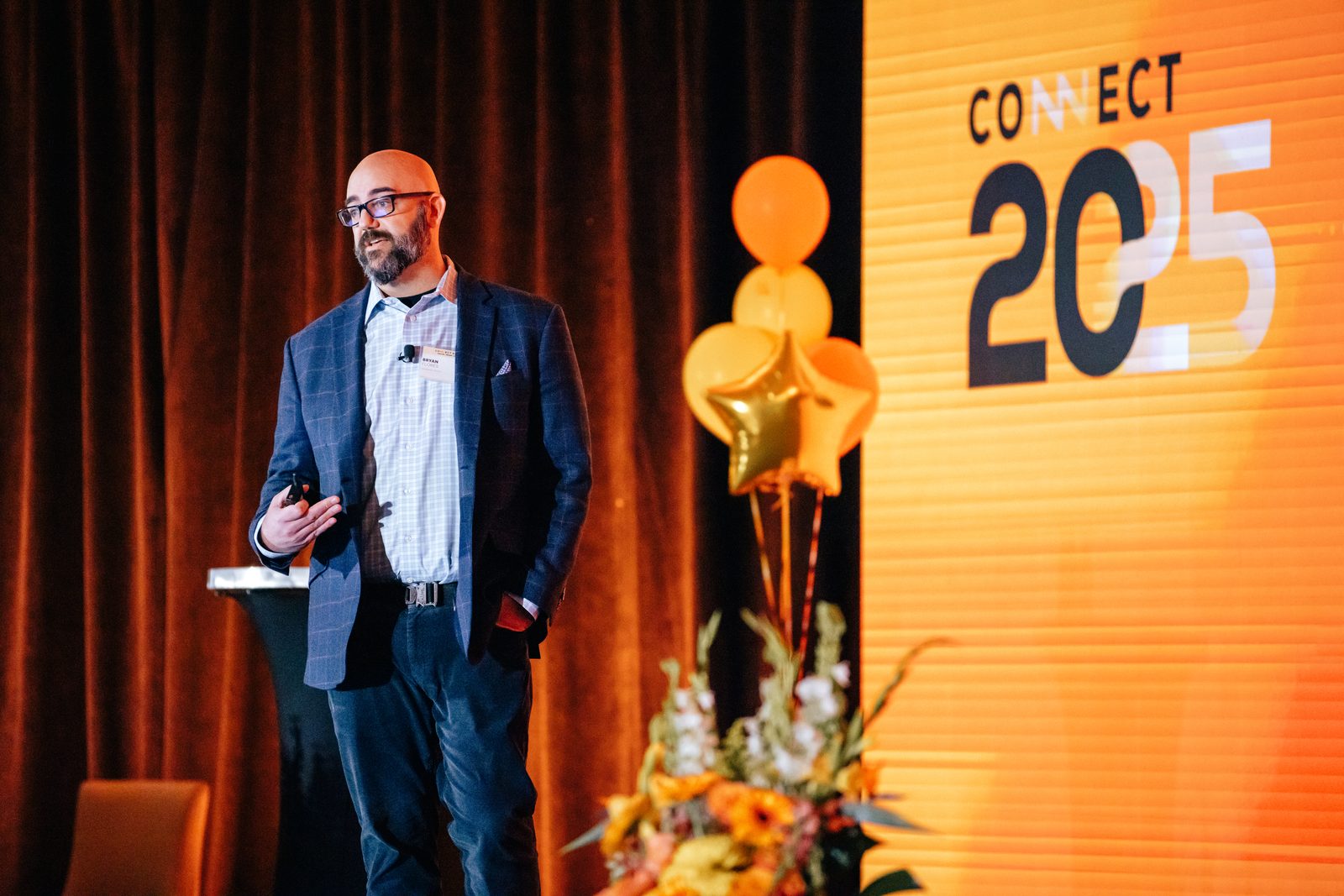 Bryan Flores speaking at CONNECT 2025